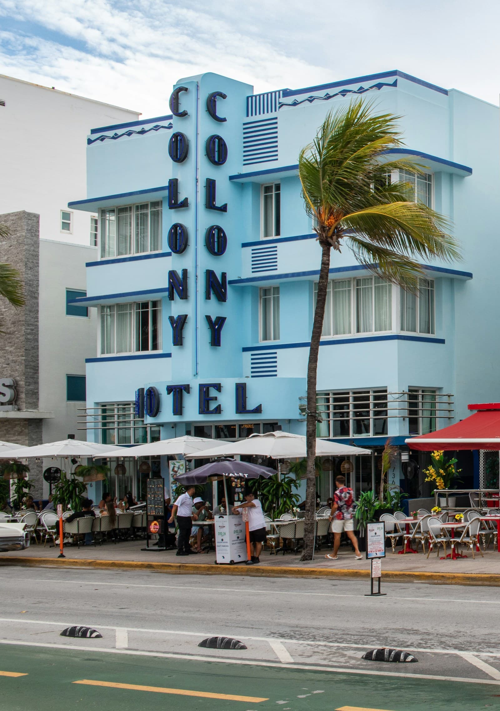 Blue Art Deco building with palm tree, South Beach